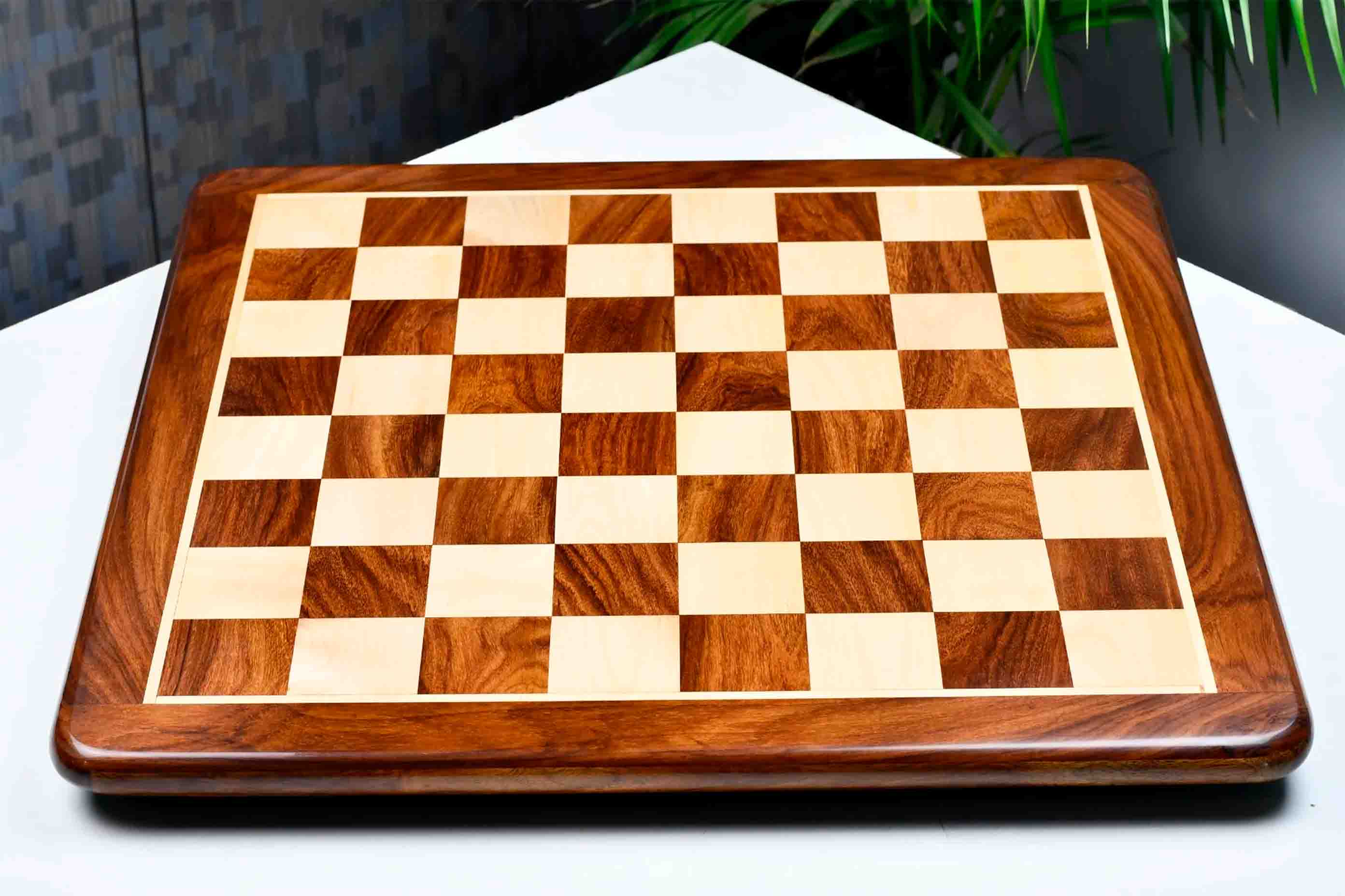 Player's Choice sheesham and maple 55mm square chess board at an angle