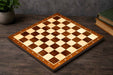 Sheesham and maple 38mm square notation chess board at an angle