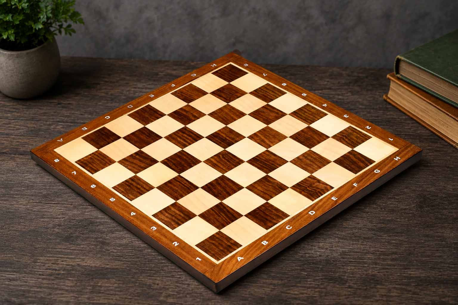 Sheesham and maple 38mm square notation chess board at an angle