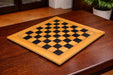 Black dyed poplar and olive veneer chess board, 55cm with 55mm squares