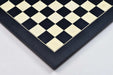 Black anigre and maple chess board photographed from above