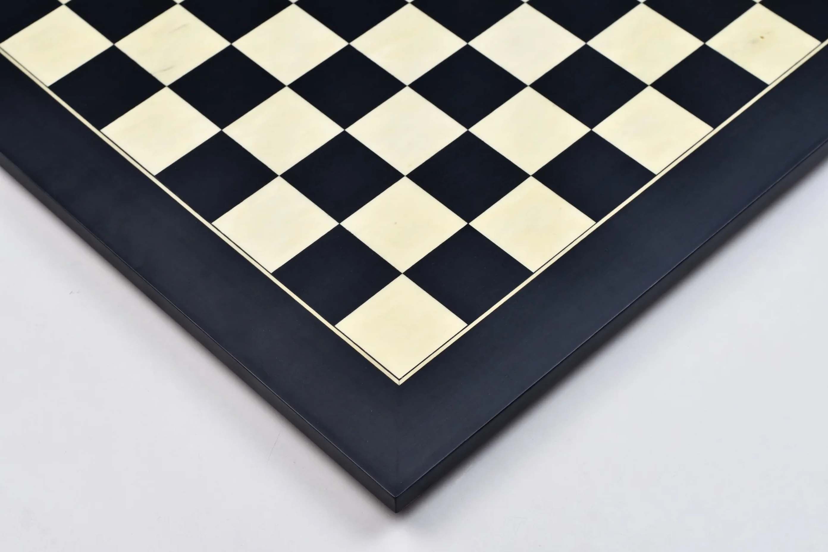 Black anigre and maple chess board photographed from above
