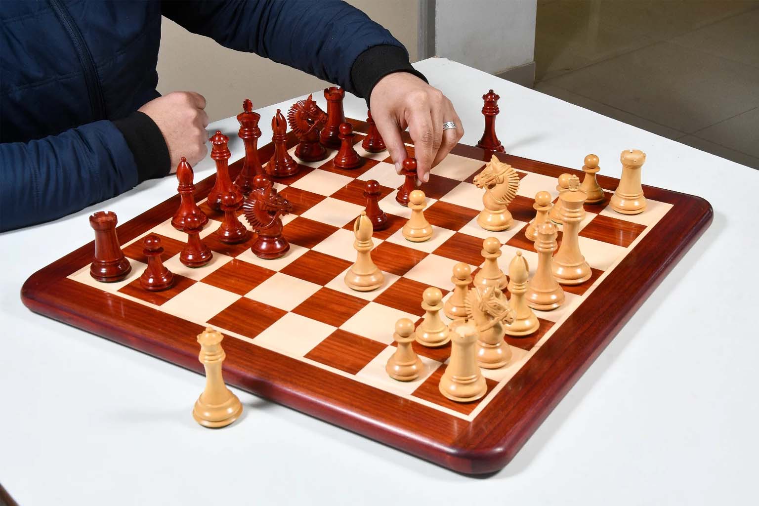 Knight carving detail on the American Bridle chess pieces in bud rosewood and boxwood