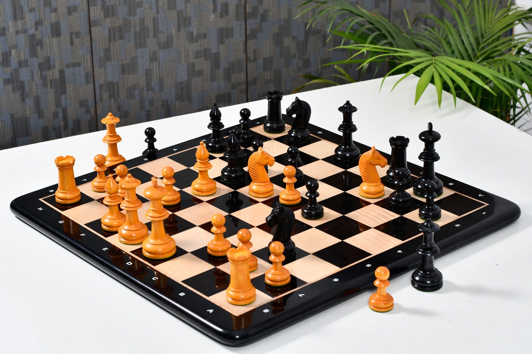 Knight carving detail on the 19th Century Austrian Antique chess pieces in ebonised and golden antiqued boxwood