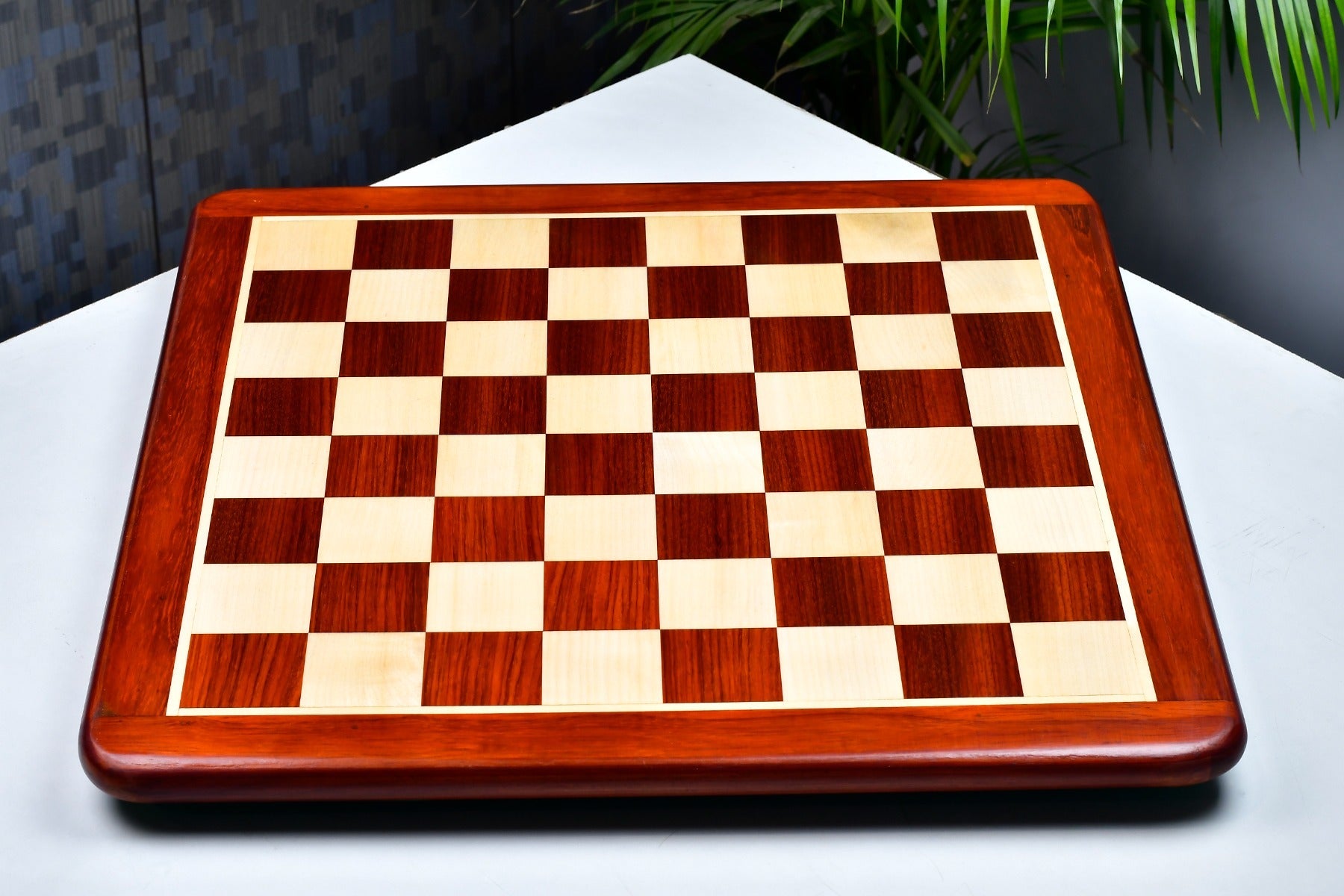 Bud rosewood and maple 50mm square chess board at an angle