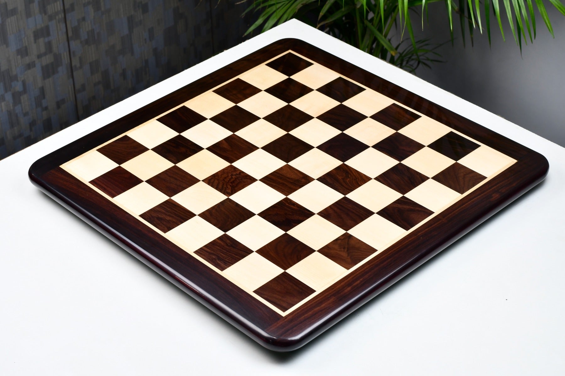 Indian rosewood and maple 55mm square chess board at an angle