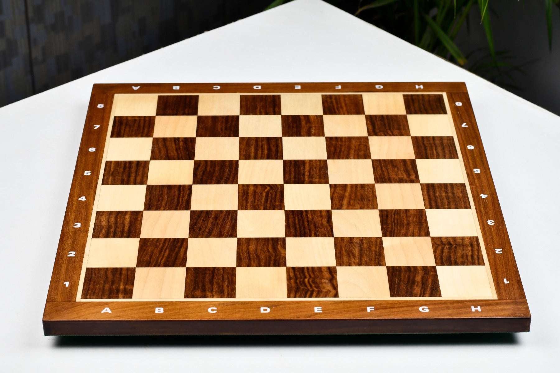 Sheesham and maple 14.5 inch notation chess board, edge view