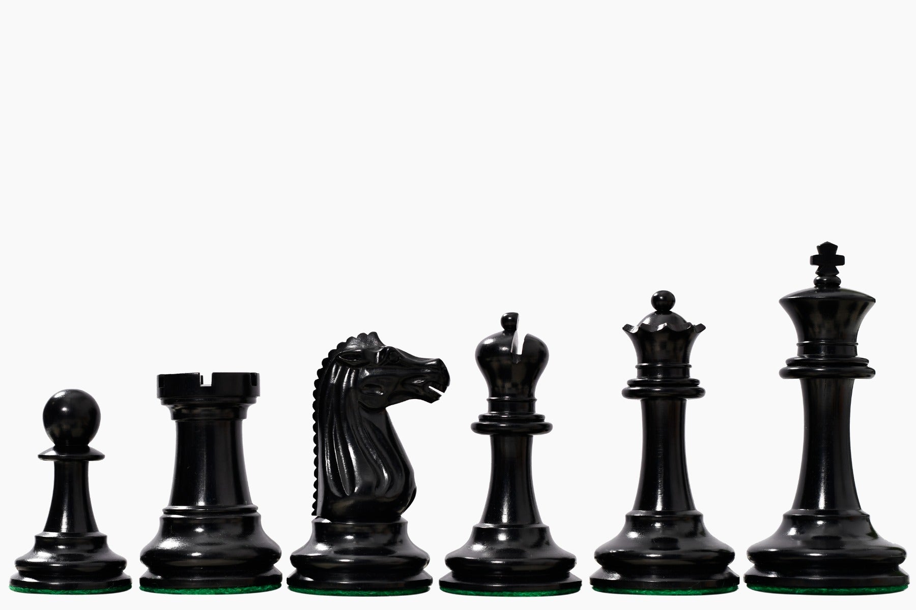 Ebony and golden antiqued chess pieces with a 103mm king and weighted felted bases