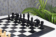 Ebony and boxwood CB Mustang Series chess pieces with two spare queens