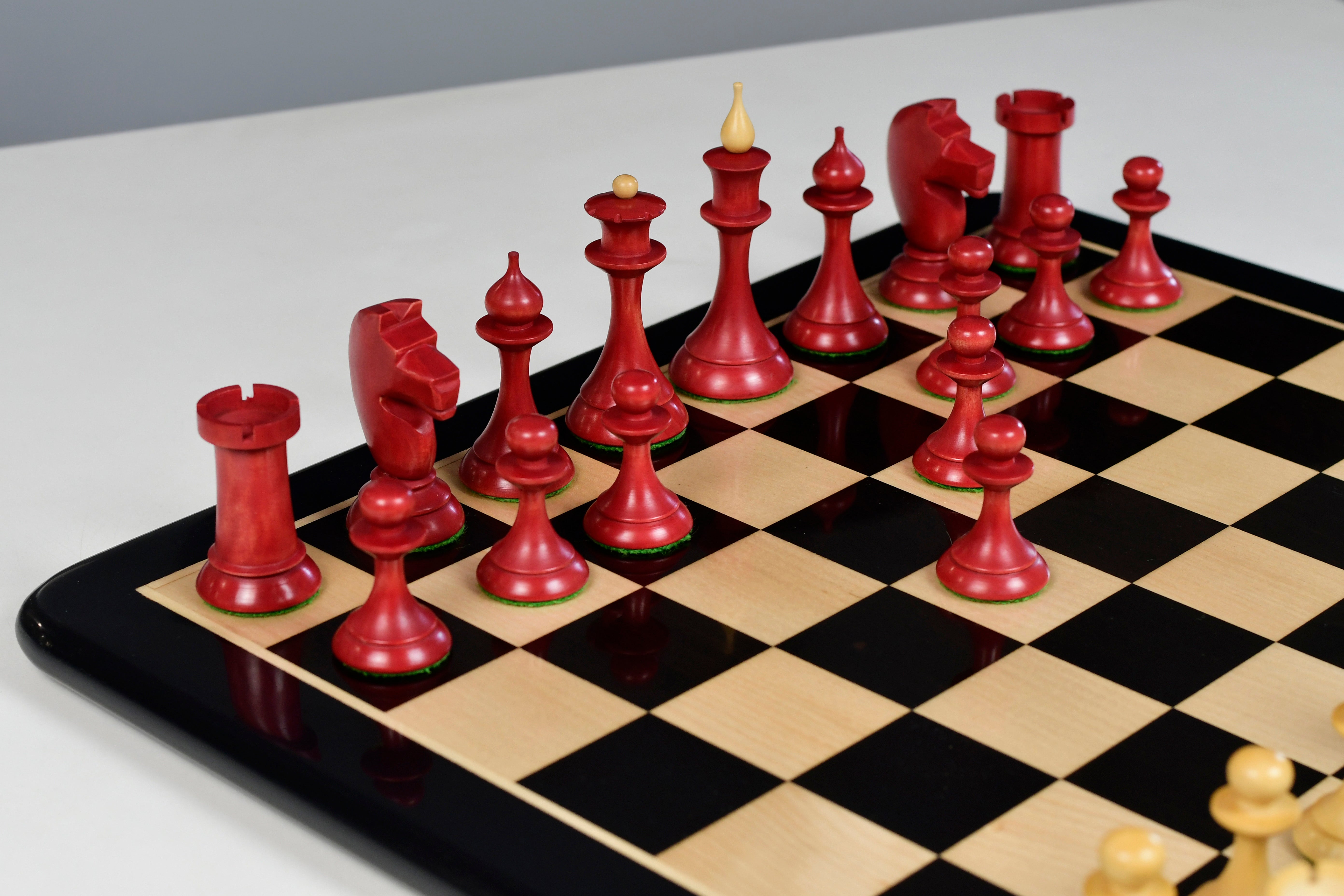 1950s Soviet Latvian wooden chess pieces, 106mm king, stained crimson finish