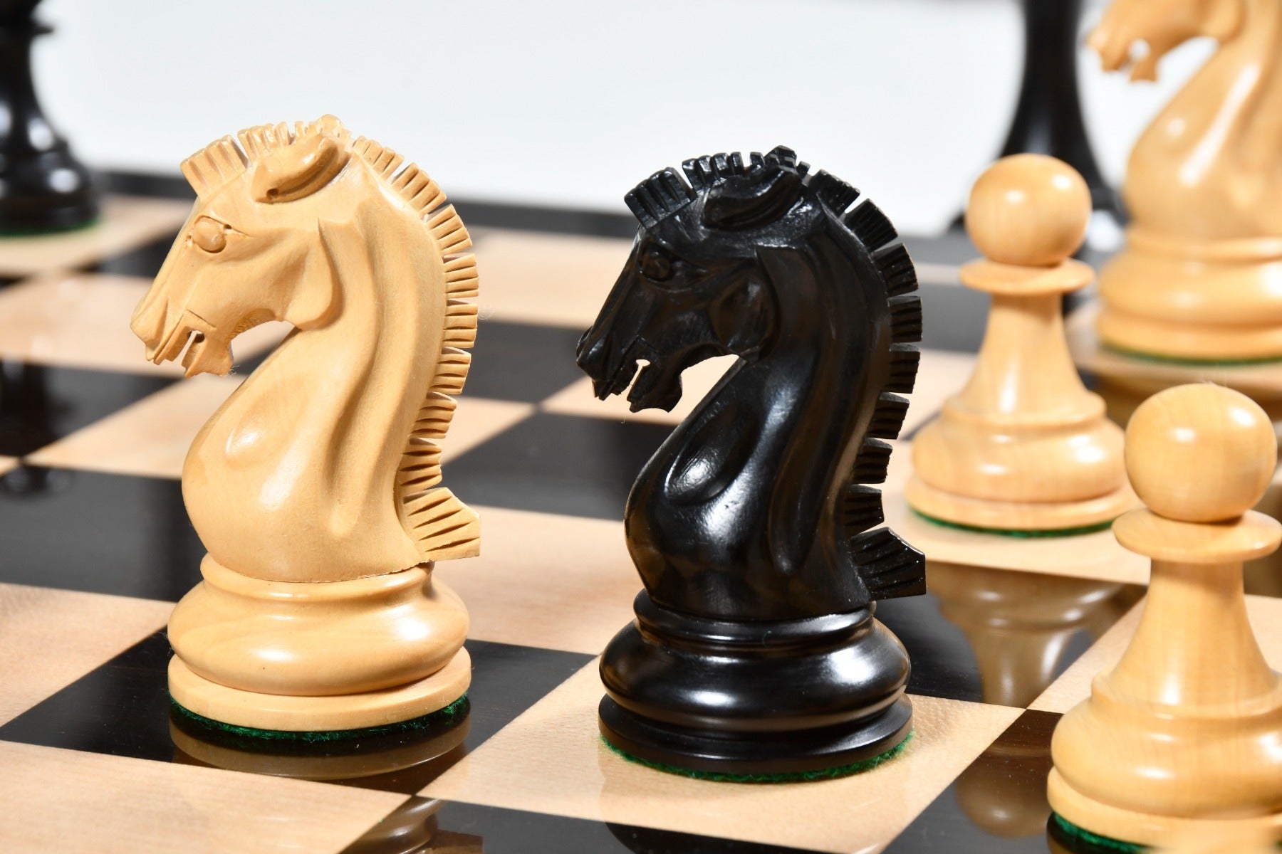 Craftsman Knight ebonised and natural boxwood Staunton pieces from Sterling Chess