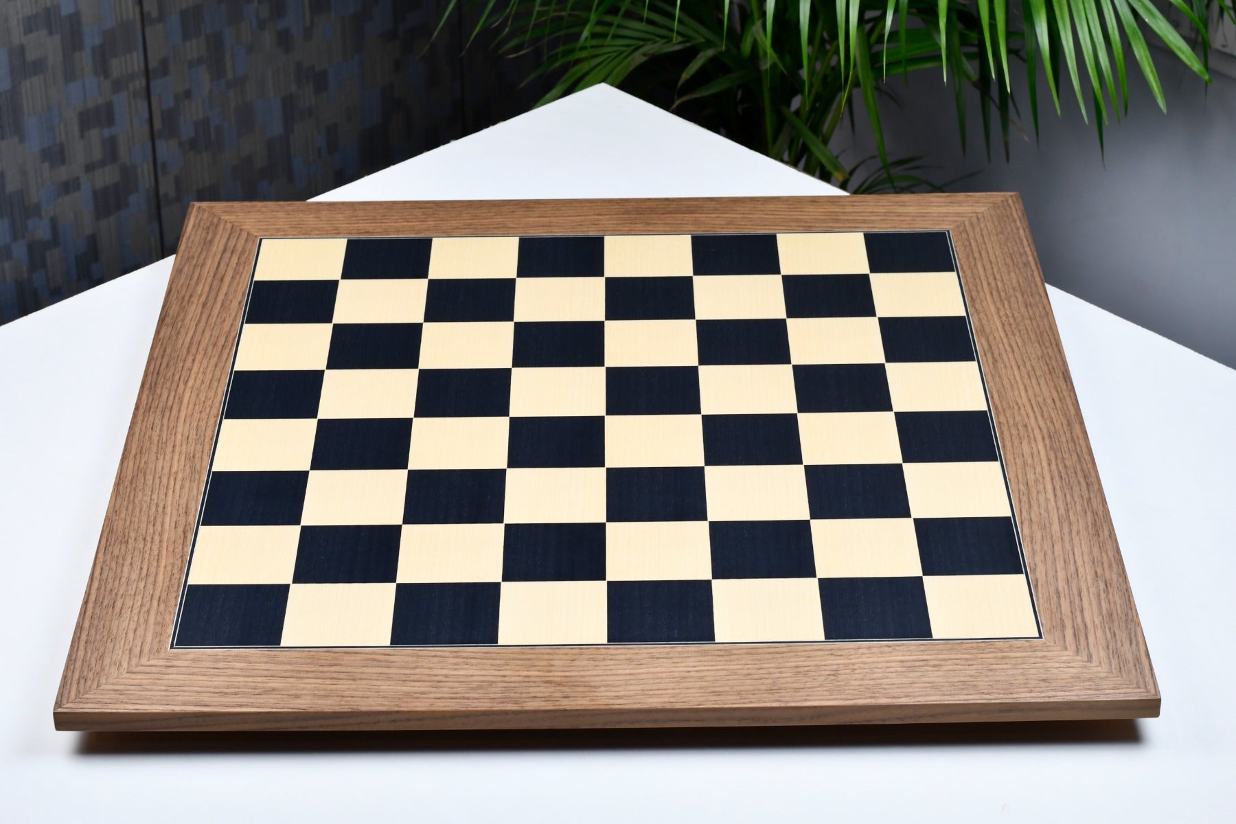 Black dyed poplar and sycamore chess board at an angle