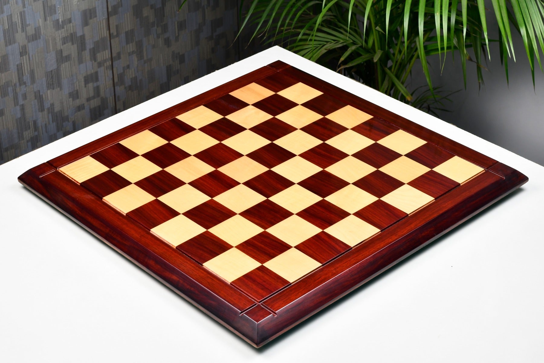 Hi-gloss bud rosewood and maple chess board photographed from above