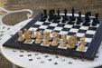Knight carving detail on the Arabian Knight Artisan Staunton chess set in genuine ebony and boxwood