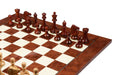 Bud rosewood chess pieces set up for play on the included 55cm red ash burl and maple board