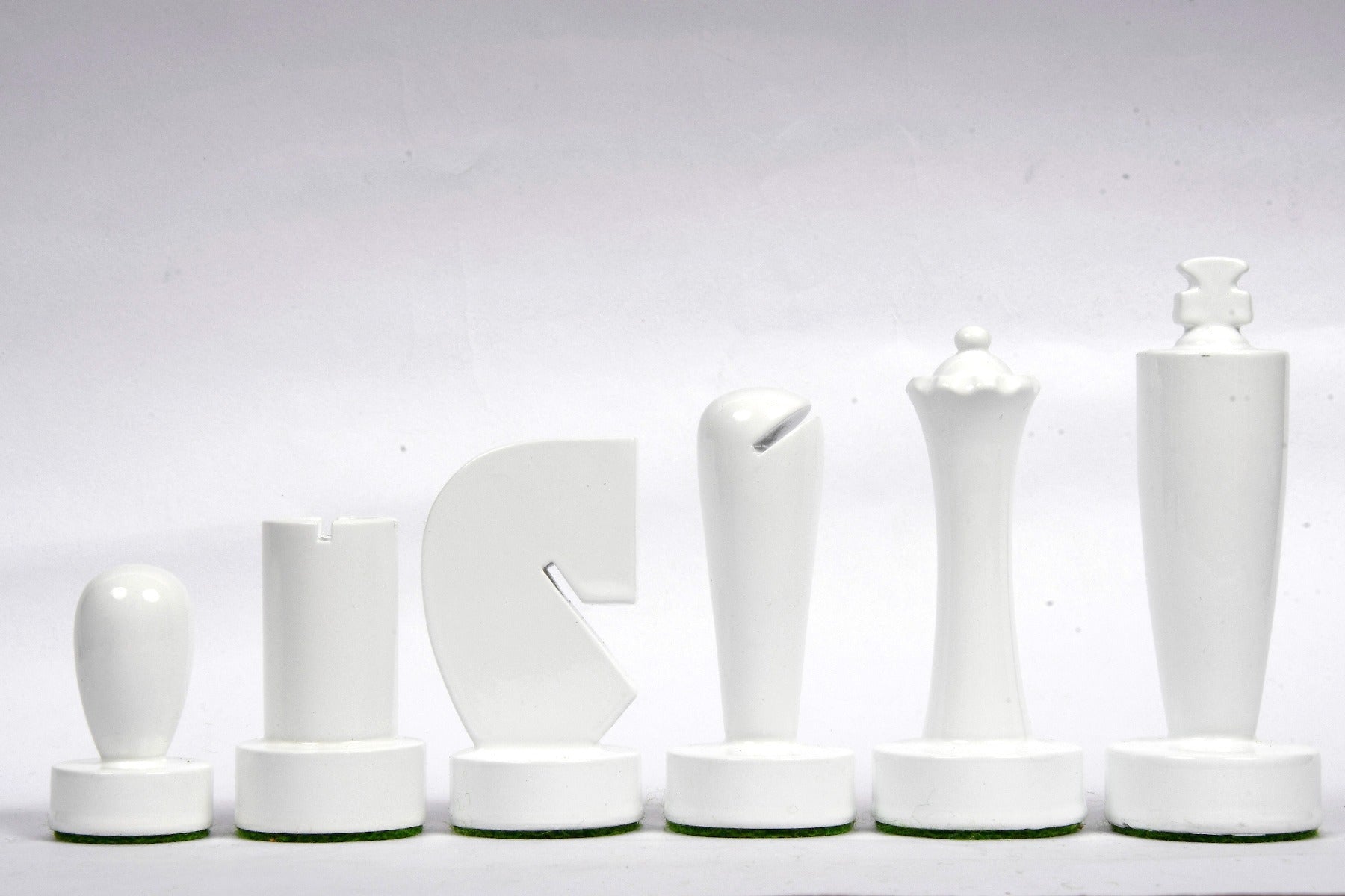 Berliner Minimalist yellow and white chess pieces, weighted with felted bases