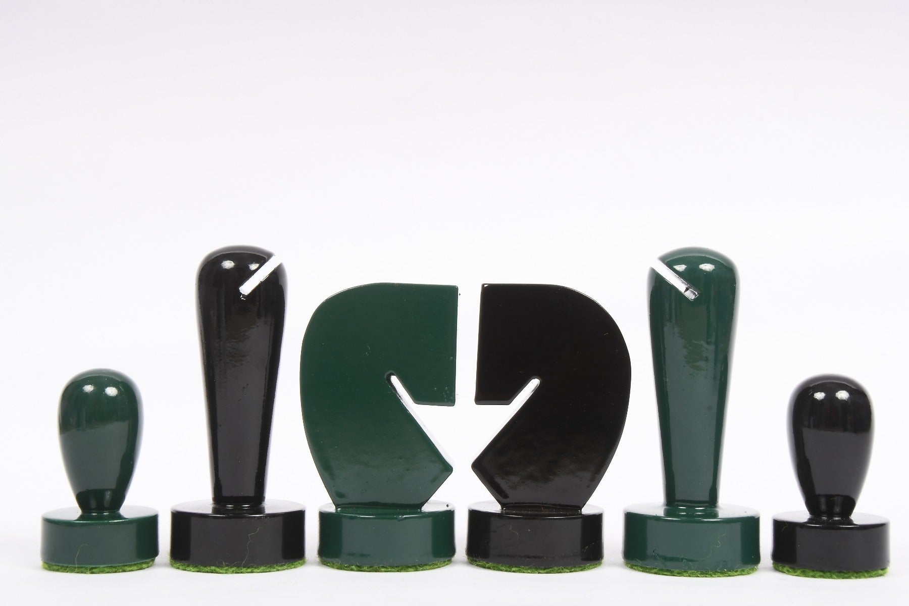 Berliner Minimalist green and black chess pieces, weighted with felted bases