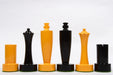 Turned minimalist chess pieces in black and yellow paint, 95mm king