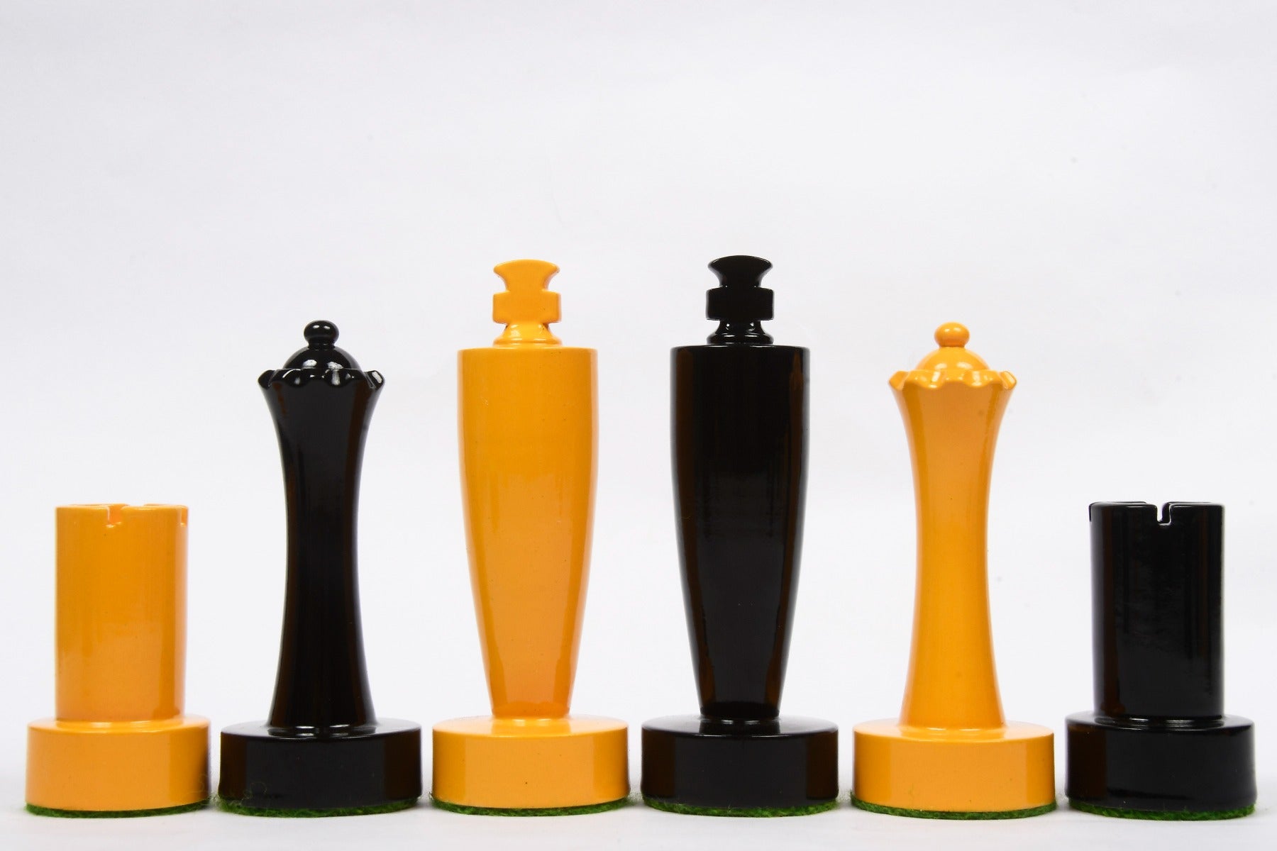 Turned minimalist chess pieces in black and yellow paint, 95mm king