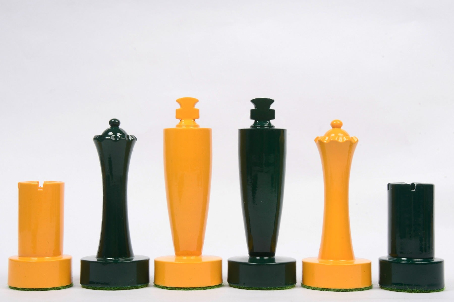 Turned minimalist chess pieces in green and yellow paint, 95mm king