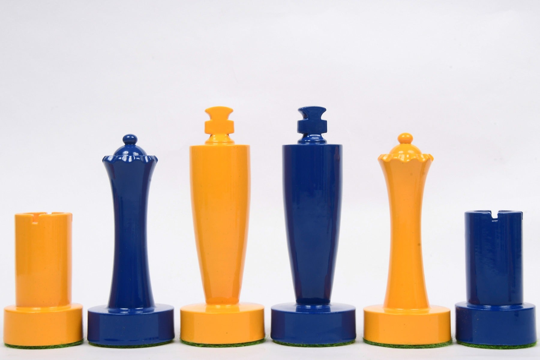 Turned minimalist chess pieces in blue and yellow paint, 95mm king