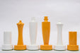 Turned minimalist chess pieces in yellow and white paint, 95mm king