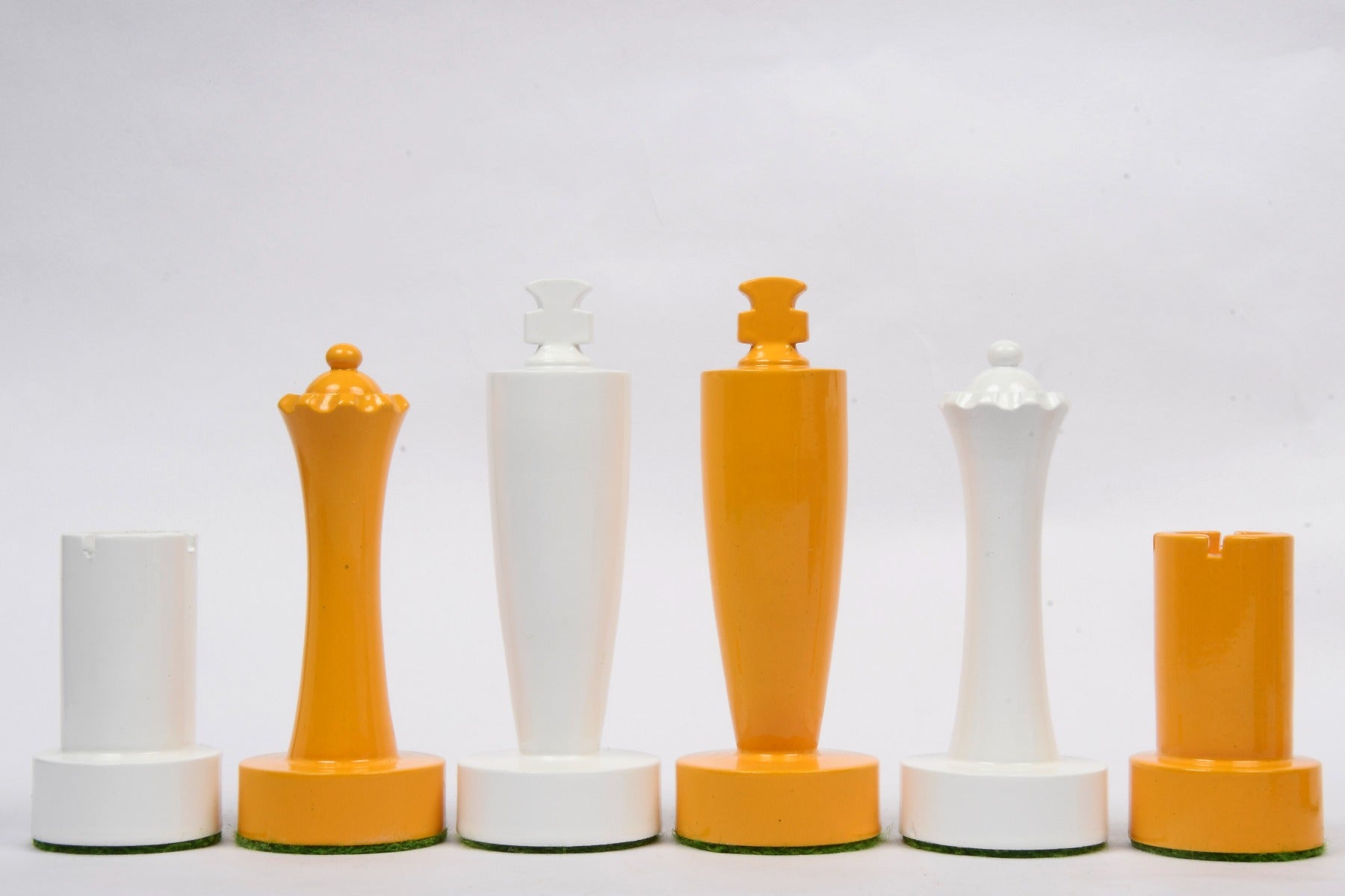 Turned minimalist chess pieces in yellow and white paint, 95mm king