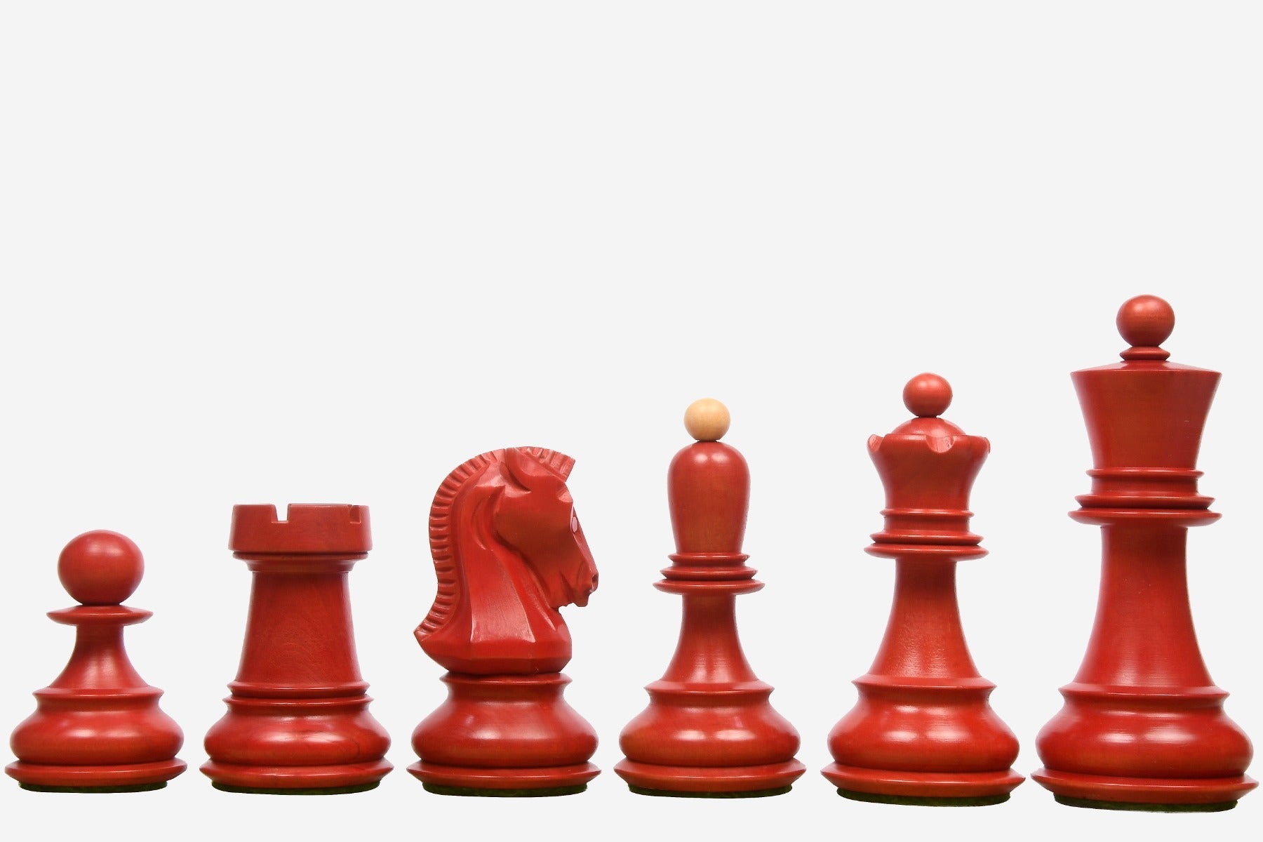 Stained crimson and natural boxwood Dubrovnik chess pieces, 34 pieces