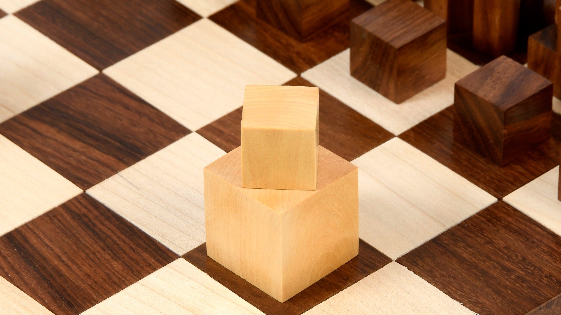 1924 Bauhaus Geometrical chess pieces, sheesham and boxwood, hand carved in India