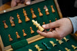 Compact folding magnetic travel chess set in sheesham and maple, Australia