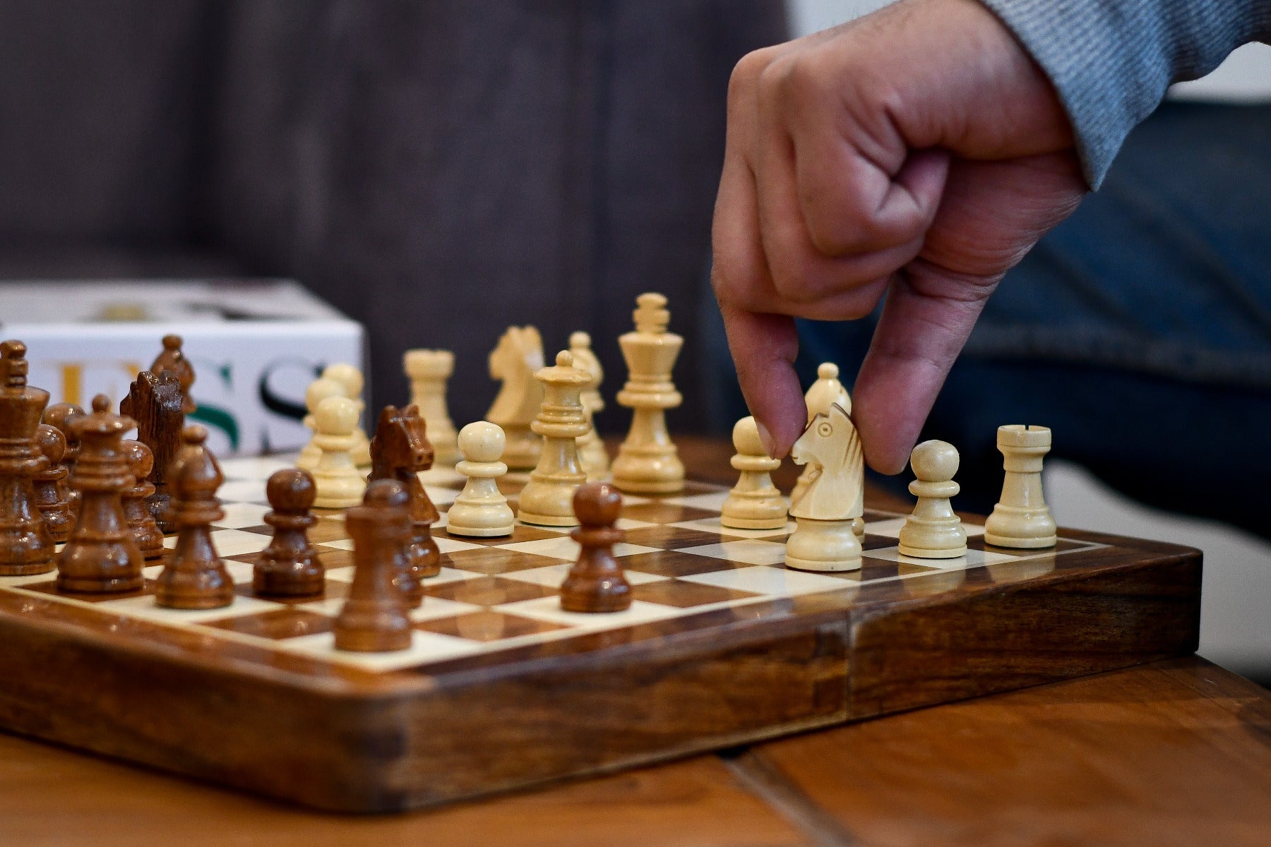 Magnetic travel chess set folding to 30 by 15 centimetres