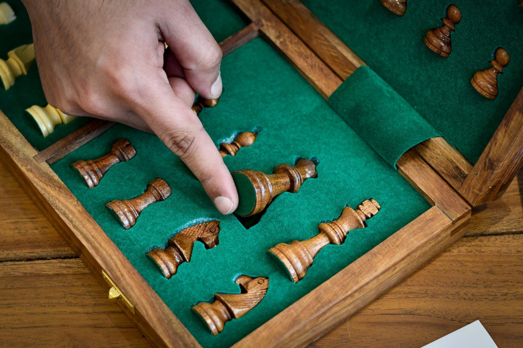 Magnetic travel chess set folding to 35 by 17 centimetres