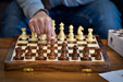 Travel Series folding magnetic chess set in lacquered sheesham and maple