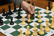 Natural white and black plastic chess pieces with a 95mm king