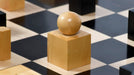 Ebonised chess pieces with a 49mm king and felted bases