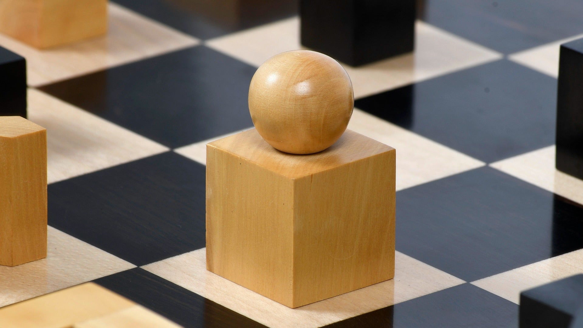Ebonised chess pieces with a 49mm king and felted bases