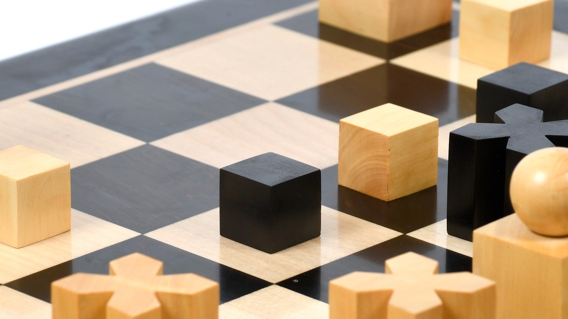Full 34 piece 1924 Bauhaus Geometrical chess set in ebonised and natural boxwood, Sterling Chess Australia