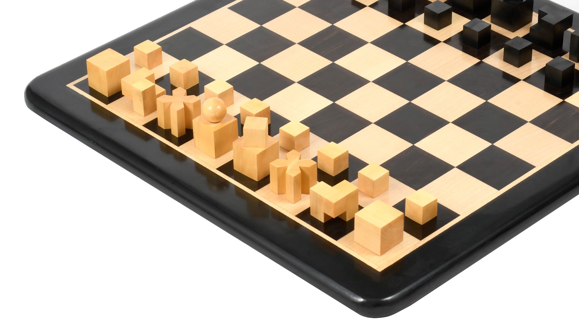 Ebonised chess pieces set up for play on the included 48cm ebony and boxwood board