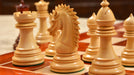 Full Ferocious Elite Series chess set with its 58cm solid bud rosewood and maple board, from Sterling Chess