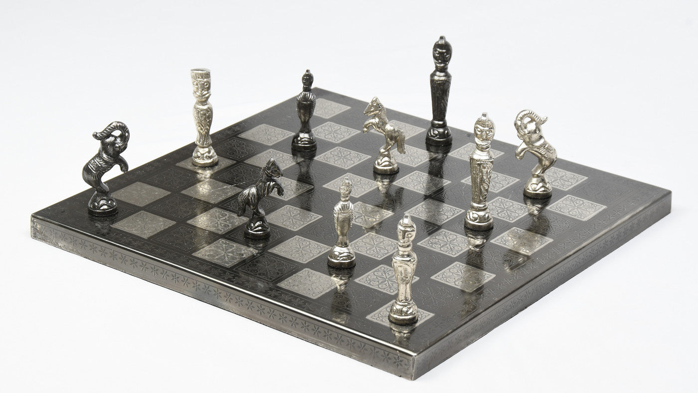 Black and silver brass chess set, full army in playing position