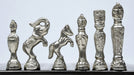 Shiny black brass vintage chess pieces, detail of the crowned king
