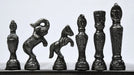 Black and silver brass chess set arranged on 40mm squares
