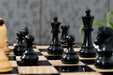Ebonised boxwood Dubrovnik chessmen paired with natural boxwood, 34 pieces