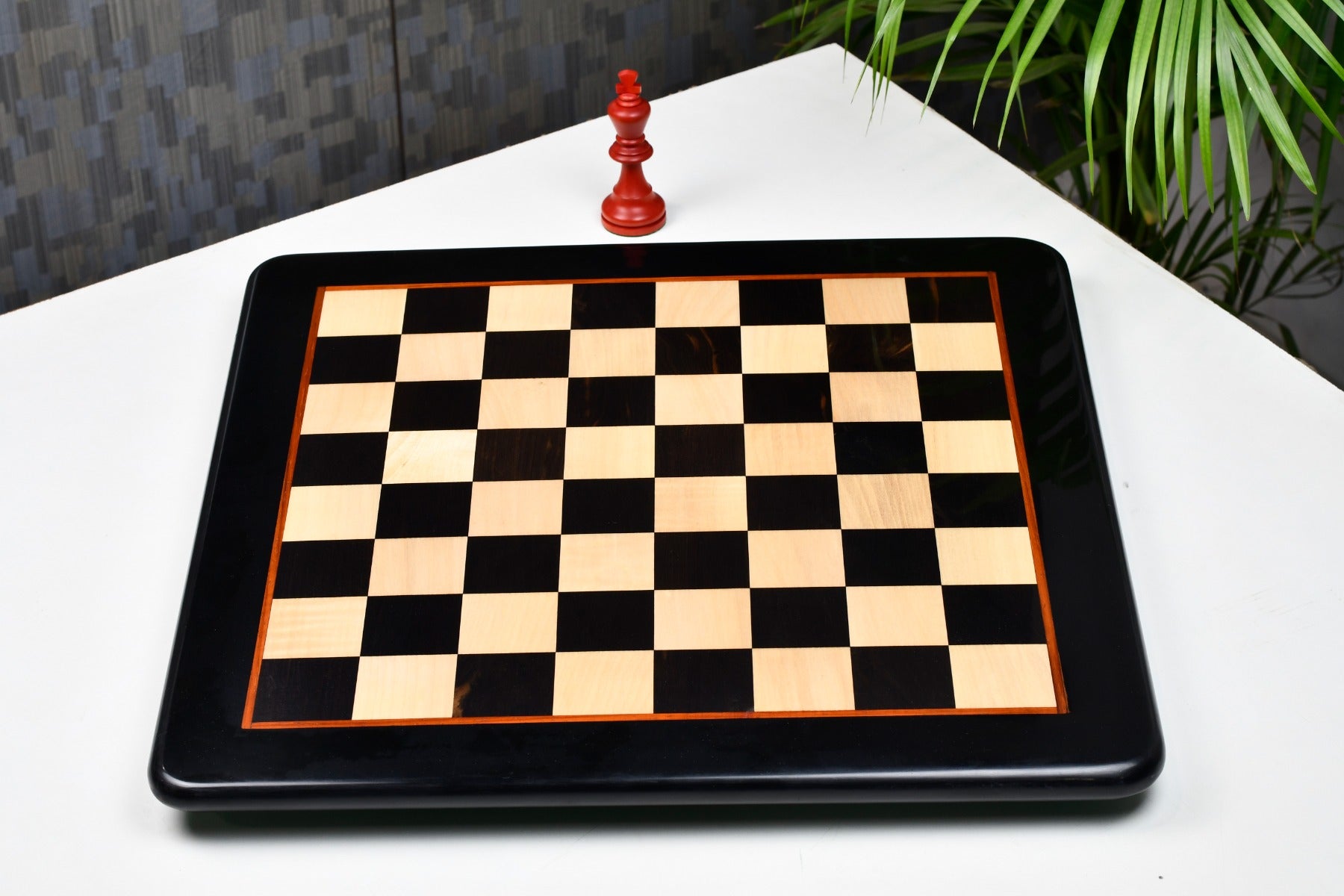 Ebony and maple 45mm square chess board at an angle