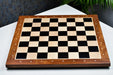 Ebony and maple sheesham border notation chess board at an angle