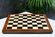 Ebony and maple chess board showing its 25mm thickness