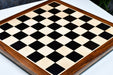 Ebony and maple sheesham border 55mm square chess board at an angle