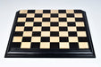 Ebony and boxwood chess board, close detail of the ebonised frame