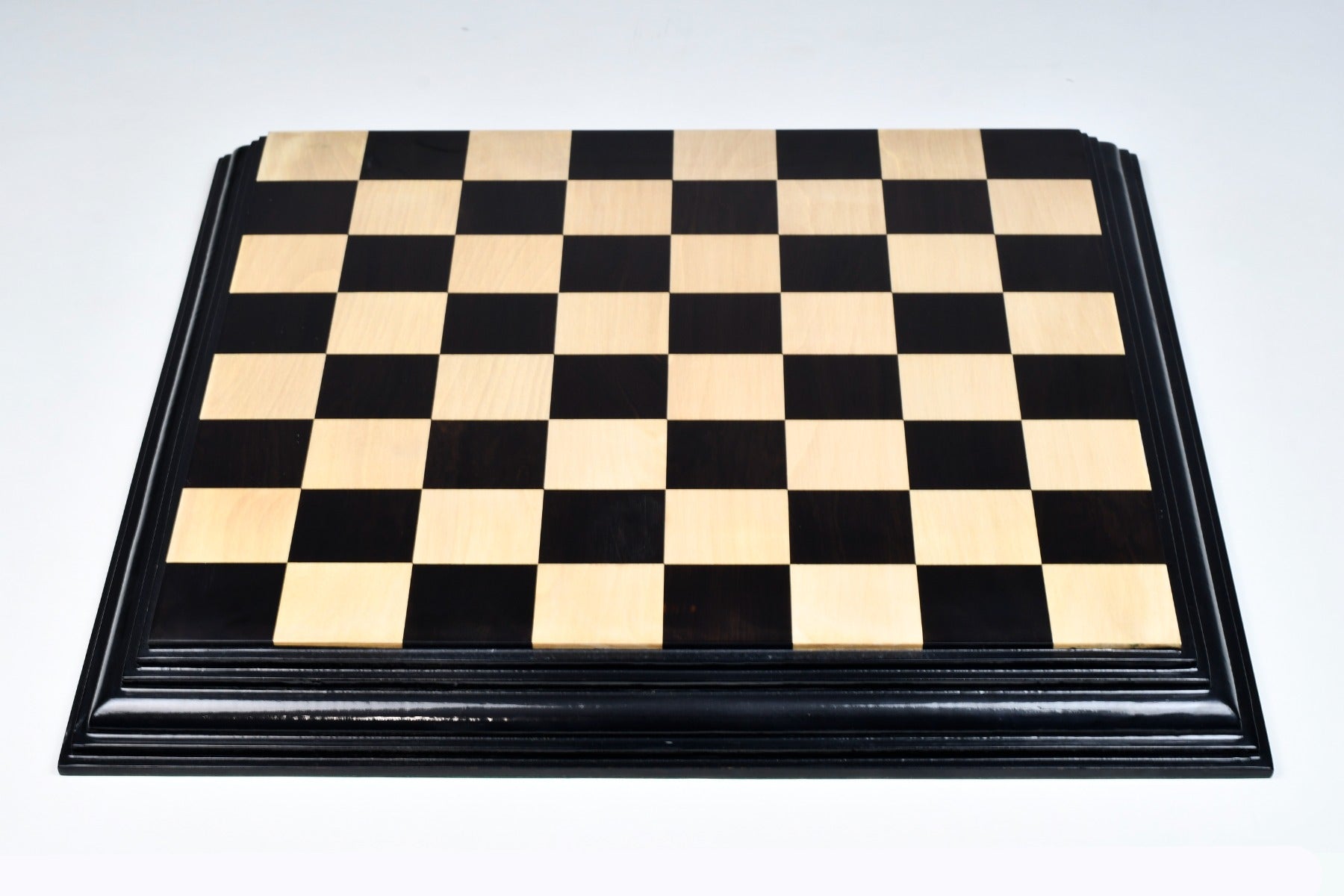 Ebony and boxwood chess board, close detail of the ebonised frame