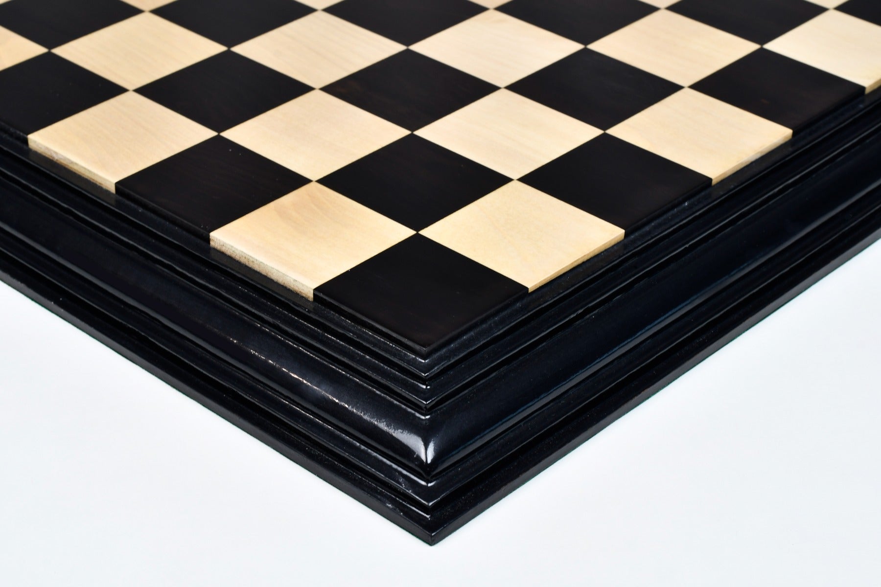 Ebony and boxwood luxury chess board photographed from above